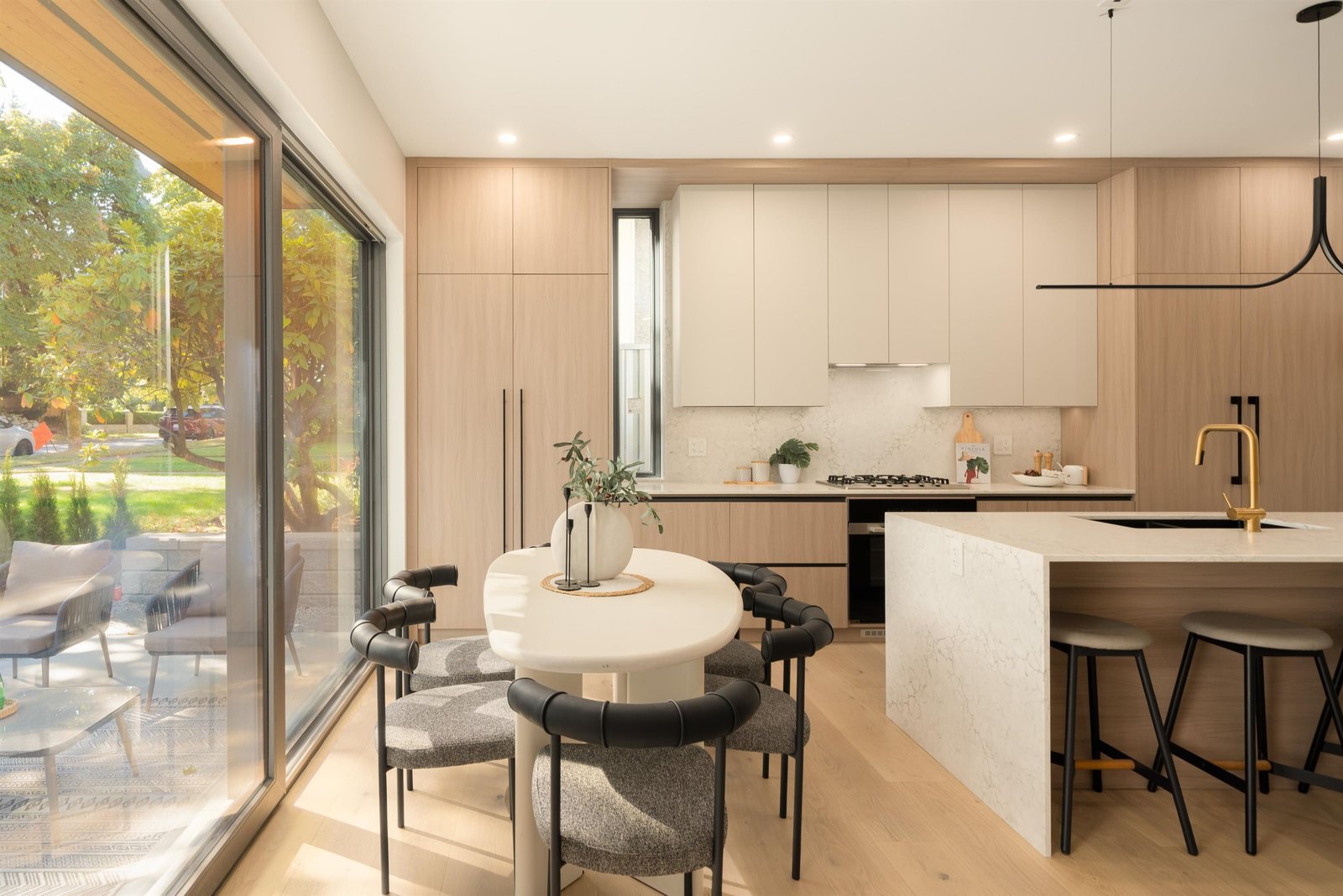 Dining and kitchen with patio doors at 1-2941 W 29th Ave, Mackenzie Heights, Vancouver