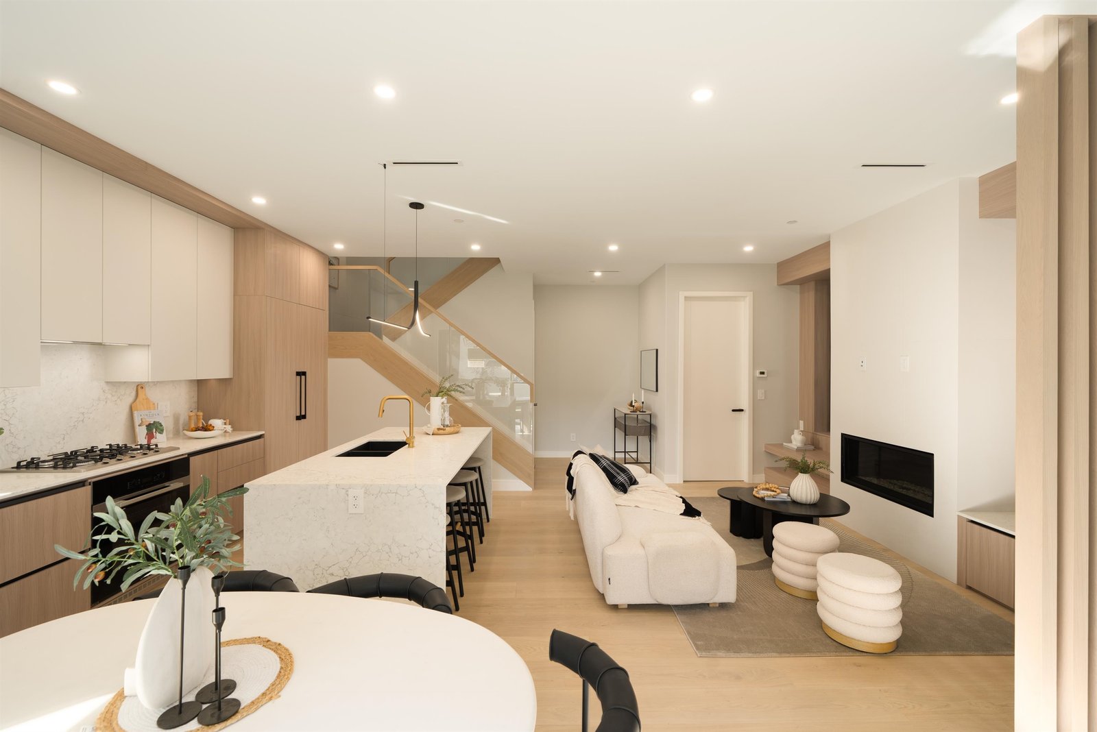 Open-plan living and kitchen with staircase at 1-2941 W 29th Ave, Mackenzie Heights, Vancouver
