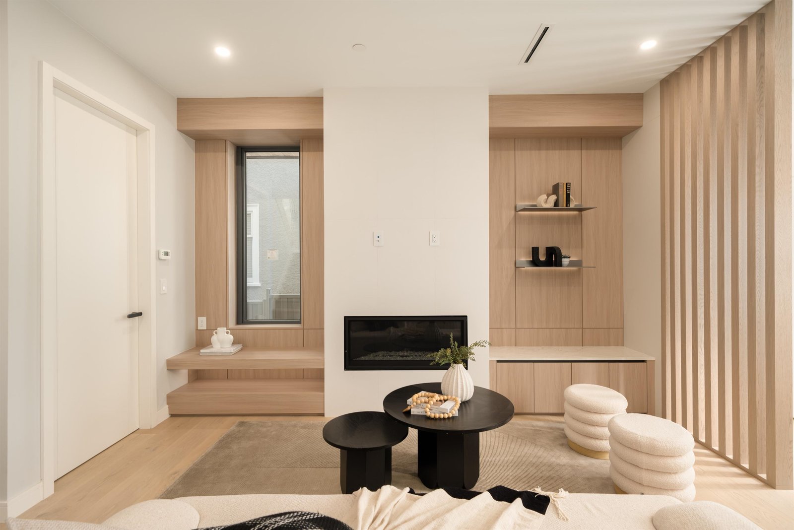 Living room fireplace with custom millwork at 1-2941 W 29th Ave, Mackenzie Heights, Vancouver