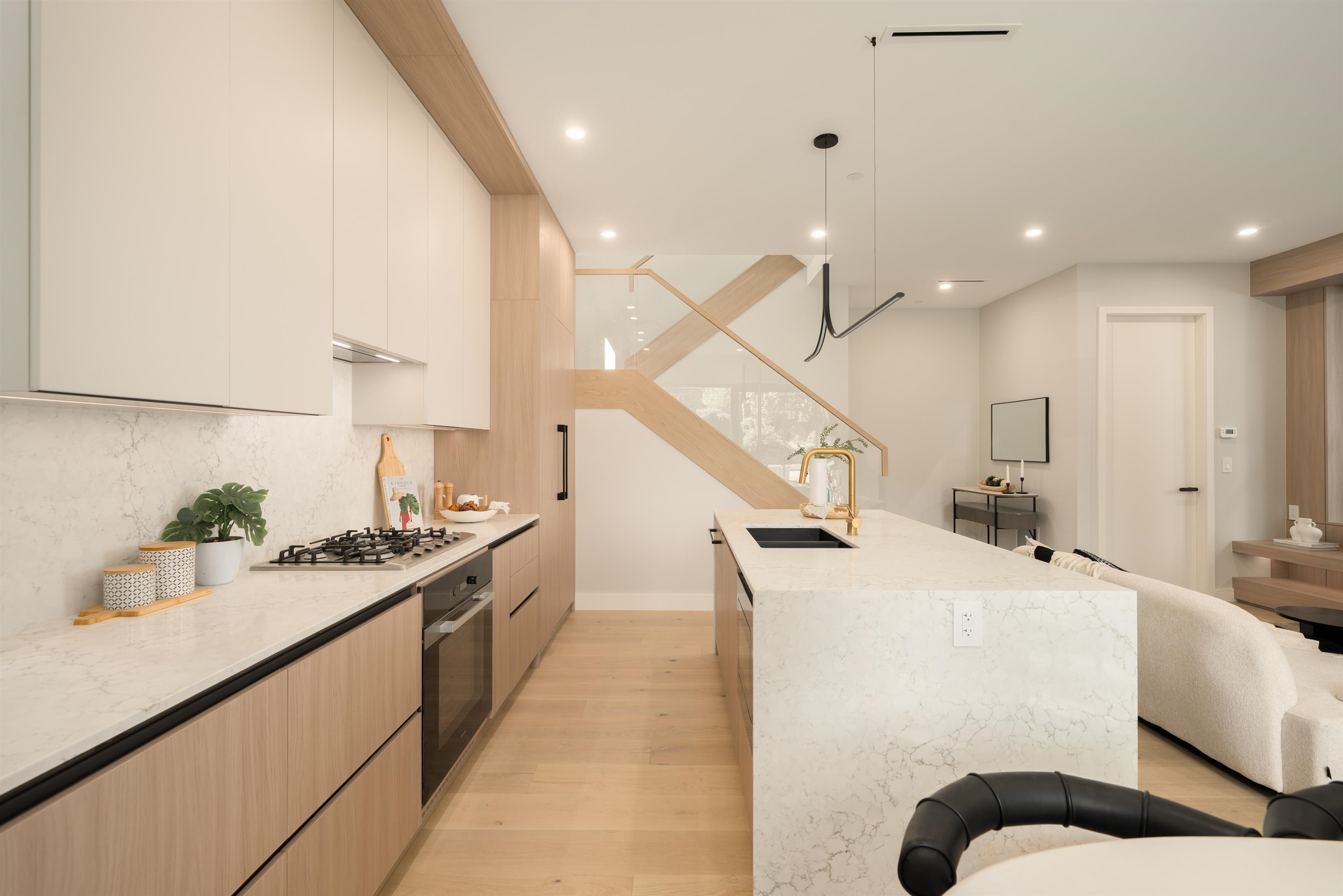 Kitchen cooktop and custom cabinetry at 1-2941 W 29th Ave, Mackenzie Heights, Vancouver