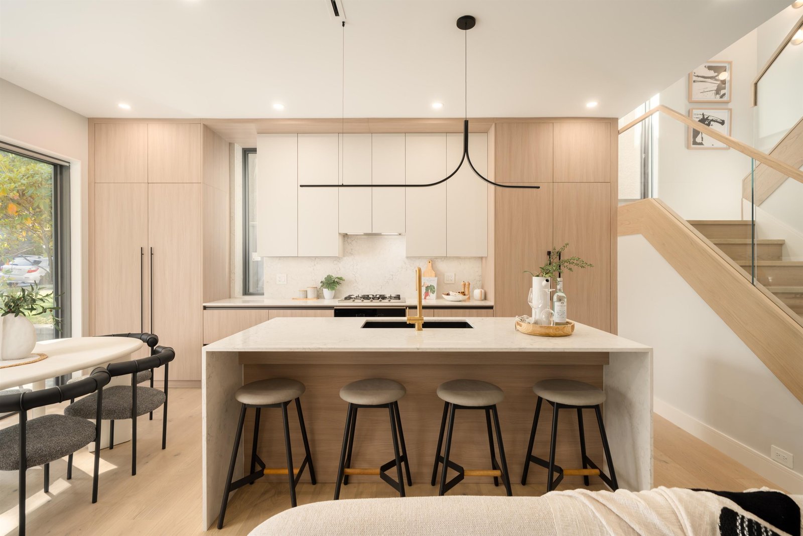 Kitchen island front with staircase at 1-2941 W 29th Ave, Mackenzie Heights, Vancouver
