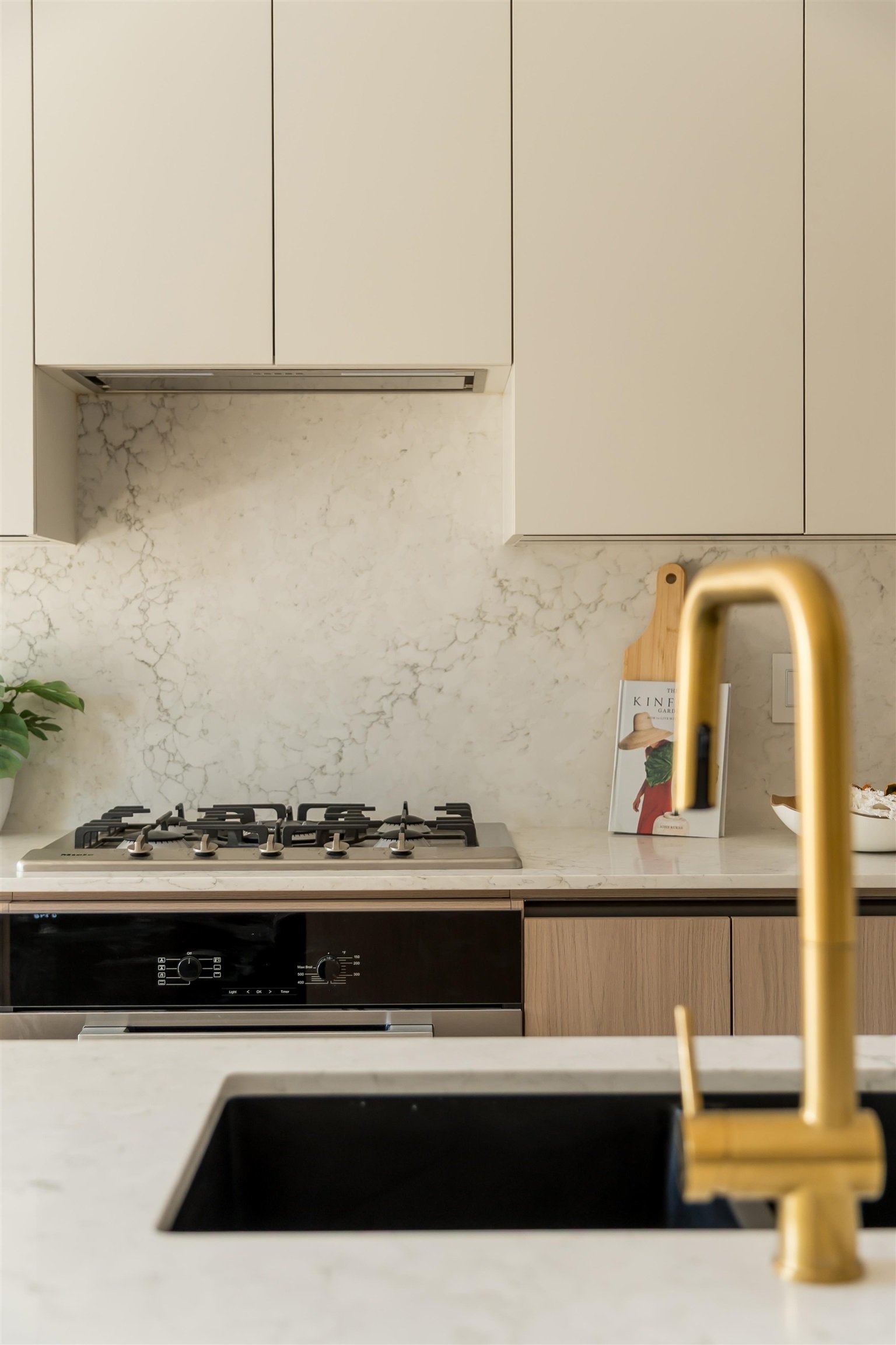 Brass faucet and cooktop detail at 1-2941 W 29th Ave, Mackenzie Heights, Vancouver