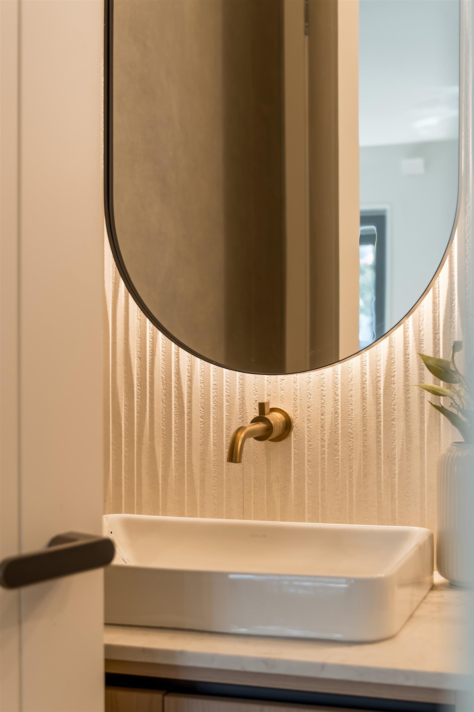 Powder room sink with brass faucet at 1-2941 W 29th Ave, Mackenzie Heights, Vancouver
