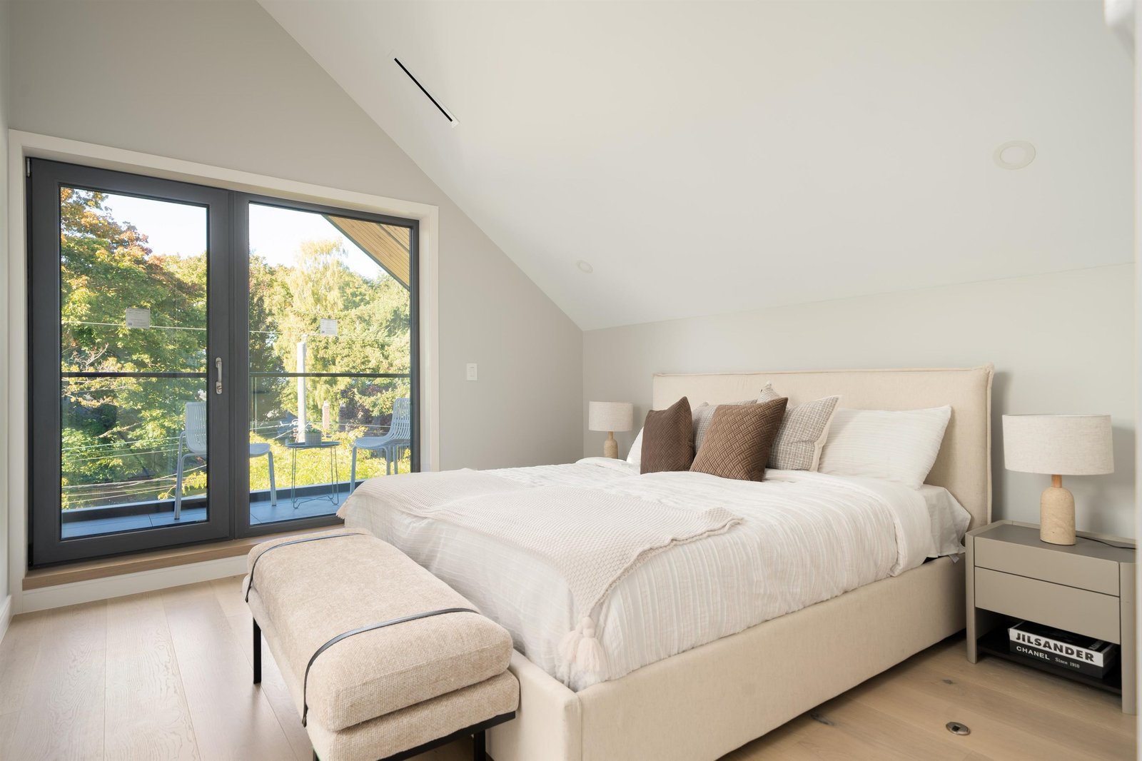 Top-floor primary bedroom with sloped ceiling at 2-2941 W 29th Ave, Mackenzie Heights, Vancouver
