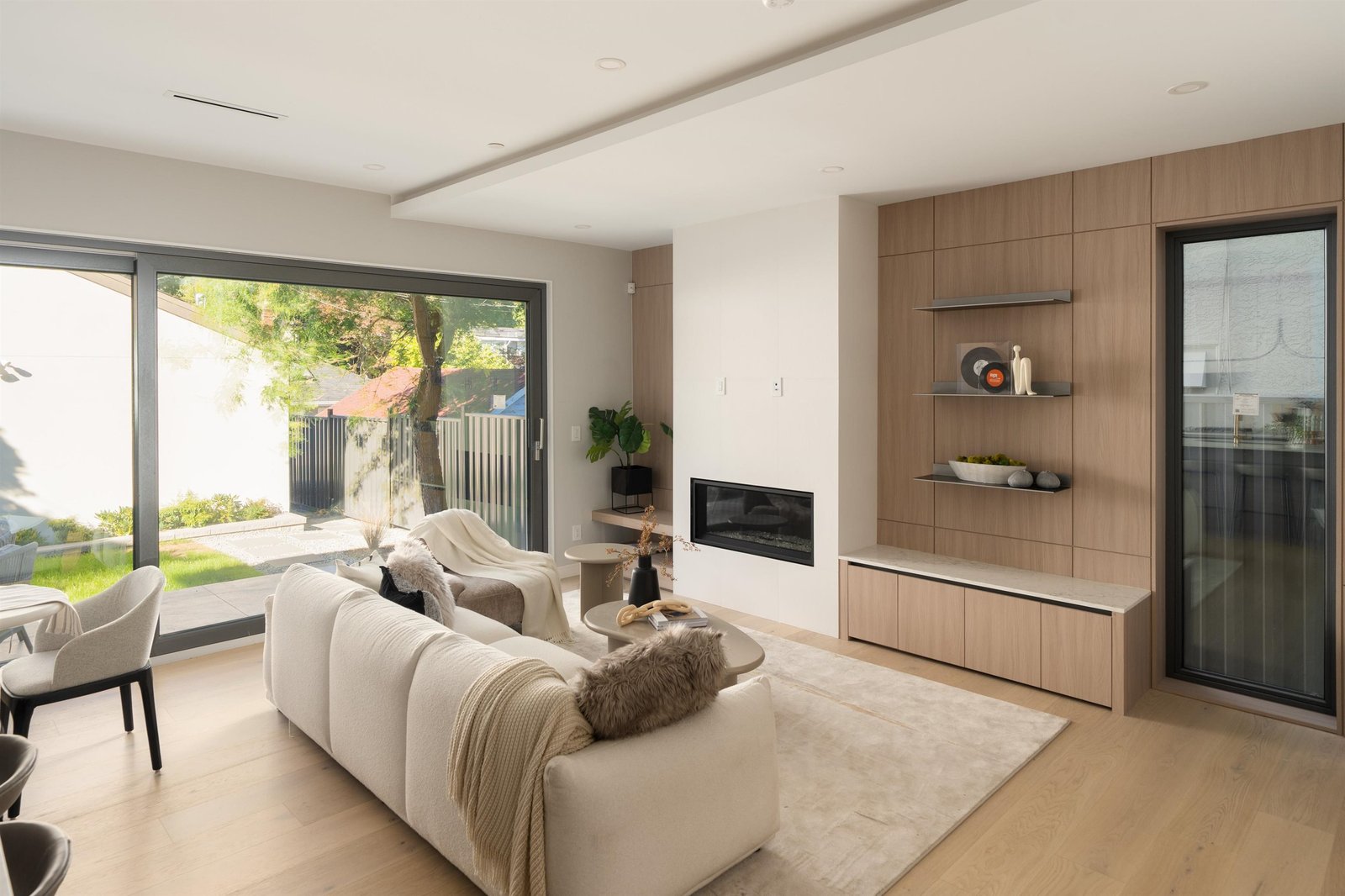 Living room with fireplace and media wall at 2-2941 W 29th Ave, Mackenzie Heights, Vancouver